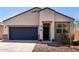 Charming single-story home featuring a two-car garage and low-maintenance desert landscaping at 5101 E Sharbel Rd, San Tan Valley, AZ 85143