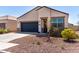 Well-kept home boasting a two-car garage, desert landscaping, and a welcoming entrance at 5101 E Sharbel Rd, San Tan Valley, AZ 85143
