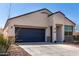 Nice single-story home with desert landscaping, a two-car garage, and a modern design at 5101 E Sharbel Rd, San Tan Valley, AZ 85143