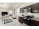 Modern kitchen featuring stainless steel appliances and a large island with bar stool seating at 5101 E Sharbel Rd, San Tan Valley, AZ 85143