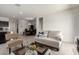 Open living area showcases tile flooring, neutral decor, and seamless flow into the kitchen at 5101 E Sharbel Rd, San Tan Valley, AZ 85143