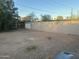 Spacious backyard with a cinderblock fence, providing privacy and space for outdoor activities, enhanced by landscaping at 532 E Cheery Lynn Rd, Phoenix, AZ 85012