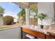 Well-lit makeup desk offers a view of the beautifully landscaped back yard with mature fruit trees and green grass at 5426 E Fountain Cir, Mesa, AZ 85205