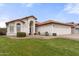 Charming single-story home featuring a well-manicured lawn, tiled roof, and an attached two-car garage at 5426 E Fountain Cir, Mesa, AZ 85205