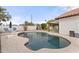 Beautiful backyard pool surrounded by a stamped concrete deck, perfect for relaxation and recreation at 5426 E Fountain Cir, Mesa, AZ 85205