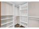 Spacious walk-in closet with white shelving and wire baskets at 6334 E Le Marche Ave, Scottsdale, AZ 85254