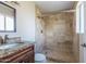 Bathroom with travertine shower and granite vanity at 7430 E Coronado Rd, Scottsdale, AZ 85257