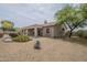 Attractive single story home featuring a desert landscaped backyard, covered patio, and mountain views at 9142 E La Posada Ct, Scottsdale, AZ 85255