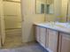 This bathroom offers dual sinks, vanity area, and a shower with glass door at 9142 E La Posada Ct, Scottsdale, AZ 85255