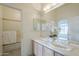 Bathroom featuring double sinks, vanity, and adjacent shower and tub at 9142 E La Posada Ct, Scottsdale, AZ 85255