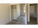Bright bedroom featuring a sliding-door closet, window, and a neutral color palette at 9142 E La Posada Ct, Scottsdale, AZ 85255
