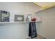 Well-organized walk-in closet with shelves, hanging rods, and storage for accessories at 9142 E La Posada Ct, Scottsdale, AZ 85255