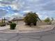 Suburban home featuring desert landscaping, a two-car garage and a circular driveway at 9142 E La Posada Ct, Scottsdale, AZ 85255