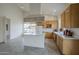Open concept kitchen with tile floors, an island, and plenty of natural light at 9142 E La Posada Ct, Scottsdale, AZ 85255