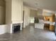 An open floor plan featuring a kitchen, dining area, fireplace and high ceilings at 9142 E La Posada Ct, Scottsdale, AZ 85255