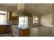A kitchen featuring light wood cabinets, stainless steel appliances, and a view to the backyard at 9142 E La Posada Ct, Scottsdale, AZ 85255
