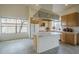 Open concept kitchen with tile floors, an island, and plenty of natural light at 9142 E La Posada Ct, Scottsdale, AZ 85255
