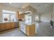 Bright kitchen with an island, tile flooring, and a view of the backyard at 9142 E La Posada Ct, Scottsdale, AZ 85255