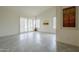Open living space with tile floors, shuttered doors and windows, with neutral paint at 9142 E La Posada Ct, Scottsdale, AZ 85255