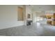 Open-concept living area with a fireplace, tile flooring, and natural light at 9142 E La Posada Ct, Scottsdale, AZ 85255