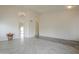 Open living area with tile floors, large windows, and chandelier lighting at 9142 E La Posada Ct, Scottsdale, AZ 85255