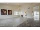 Spacious living room with tile floors, large windows, and a chandelier at 9142 E La Posada Ct, Scottsdale, AZ 85255