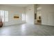 Bright, open living room with neutral walls, tile floors, and arched doorway at 9142 E La Posada Ct, Scottsdale, AZ 85255