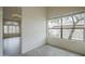 Office space with tile floors, large window, and views of the front yard at 9142 E La Posada Ct, Scottsdale, AZ 85255