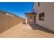 A spacious backyard features a covered patio and block wall, offering privacy and outdoor living space at 11623 W Green Dr, Youngtown, AZ 85363