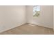 Well-lit bedroom offering cozy carpeting, a bright window, and plenty of natural light at 11623 W Green Dr, Youngtown, AZ 85363