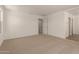 Bright bedroom with carpet and an open doorway, creating a welcoming space at 11623 W Green Dr, Youngtown, AZ 85363