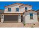 Charming two-story home with desert landscaping, and a two-car garage at 11623 W Green Dr, Youngtown, AZ 85363
