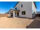 Spacious backyard featuring a covered patio with direct access to the home, perfect for outdoor relaxation and entertaining at 11627 W Green Dr, Youngtown, AZ 85363
