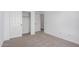 Bedroom with neutral carpet, white walls, and a closet at 11627 W Green Dr, Youngtown, AZ 85363
