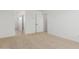 Bright bedroom view showcasing carpet, paint, and doors at 11627 W Green Dr, Youngtown, AZ 85363