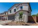 Attractive two-story home boasts a two-car garage, fresh landscaping, and inviting curb appeal at 11627 W Green Dr, Youngtown, AZ 85363