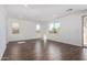 Bright, open living room with tile flooring and multiple windows offering natural light at 11627 W Green Dr, Youngtown, AZ 85363
