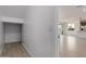 Open floor plan displaying seamless flow from entryway to kitchen, perfect for modern living at 11627 W Green Dr, Youngtown, AZ 85363