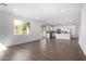 Spacious living area with tile floors, natural light, and an open layout to the kitchen at 11627 W Green Dr, Youngtown, AZ 85363