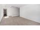 Spacious upstairs loft with plush carpeting, offering a flexible living space, and a view of stairs at 11627 W Green Dr, Youngtown, AZ 85363