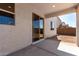 Covered back patio featuring a sliding glass door and view of the backyard space at 11627 W Green Dr, Youngtown, AZ 85363