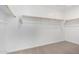 Walk-in closet featuring custom shelving offering ample storage space at 11627 W Green Dr, Youngtown, AZ 85363