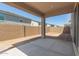 Covered patio features concrete flooring and access to the backyard space at 11631 W Green Dr, Youngtown, AZ 85363