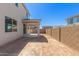 Back yard with covered patio and block wall fence, ready for your dream design at 11631 W Green Dr, Youngtown, AZ 85363