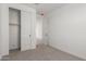 Bedroom with sliding-door closet at 11631 W Green Dr, Youngtown, AZ 85363