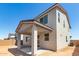 Exterior rear view of home with covered patio and stucco siding at 11631 W Green Dr, Youngtown, AZ 85363