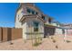 Attractive two-story home with low maintenance landscaping, brick driveway, and neutral tones at 11631 W Green Dr, Youngtown, AZ 85363