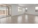 Bright living room with tile flooring, big windows, and sliding glass door to the outside at 11631 W Green Dr, Youngtown, AZ 85363