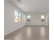 Spacious living room with tile flooring, offering plenty of natural light from multiple windows at 11631 W Green Dr, Youngtown, AZ 85363