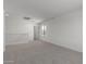 Bright living room with neutral carpet and white walls, offering a clean, modern space at 11631 W Green Dr, Youngtown, AZ 85363